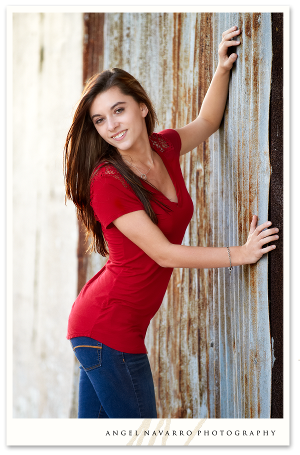 High School Senior Leaning on an Old Rusty Door