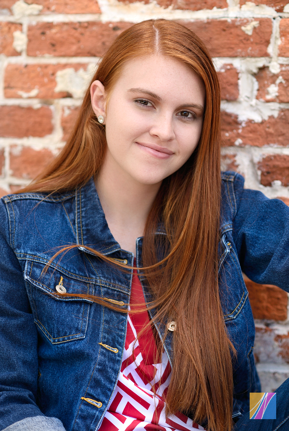 Cool HS Senior Photo on Red Brick Wall