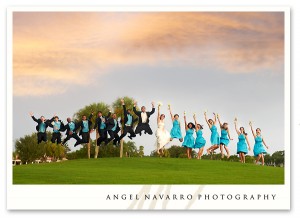 Bridal party jumps for a picture.