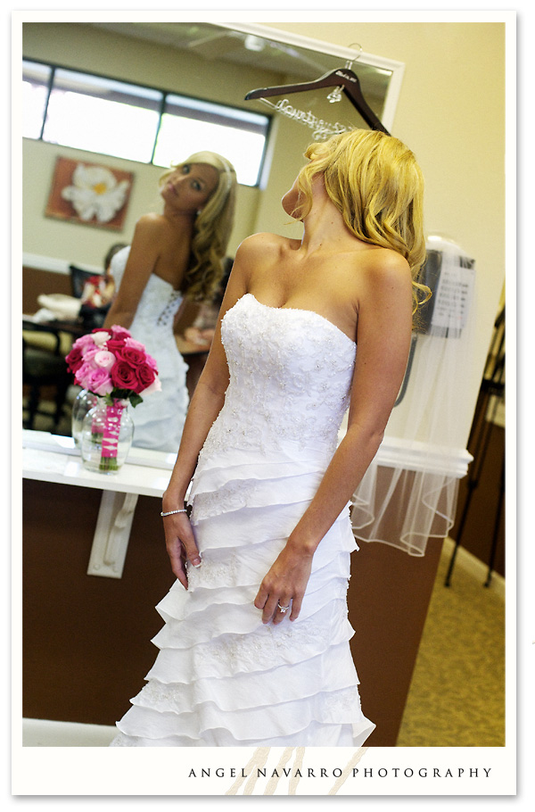 Bride looking over her gown