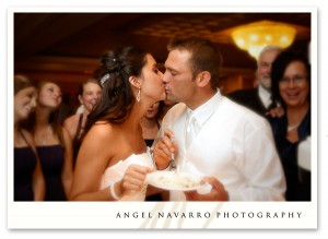 Romantic kiss following the cake cutting.