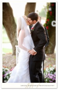 Groom kisses his lovely bride.