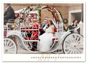 Wedding couple riding to the church on a horse-drawn carriage.