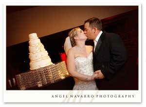cutting-wedding-cake-kiss-tampa-photographer
