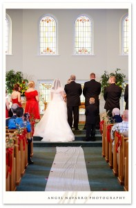 The bride and her father at the altar.