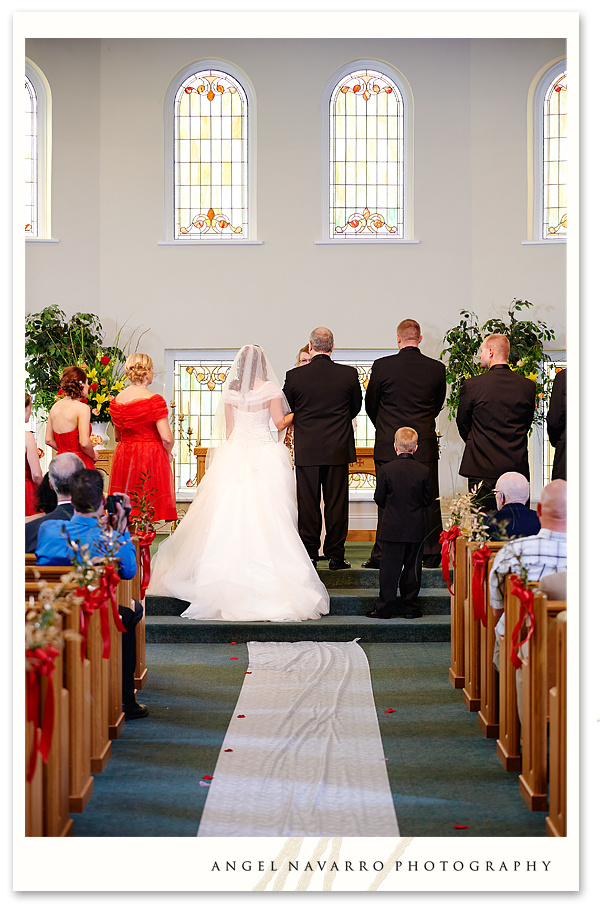 Father and daughter at the altar at the start the wedding ceremony.