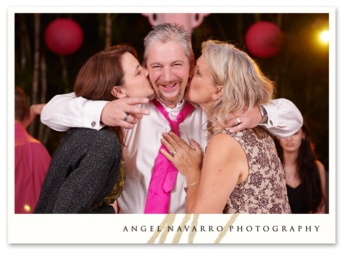 Father of the bride getting two kisses at the same time.