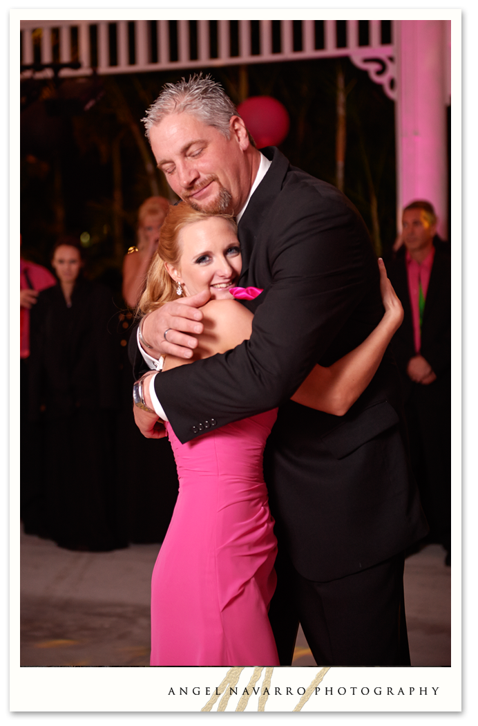 Father and daughter dance with embrace.