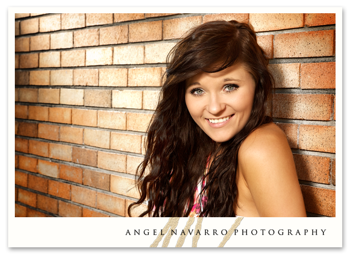 A gorgeous high school senior picture of a stylish gal.