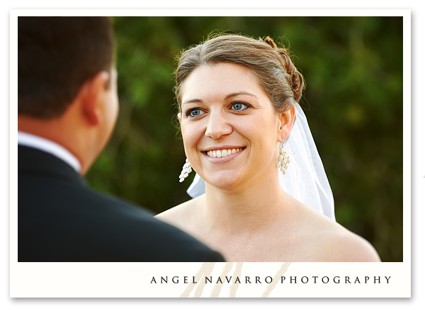 Bride listening to grooms vows.