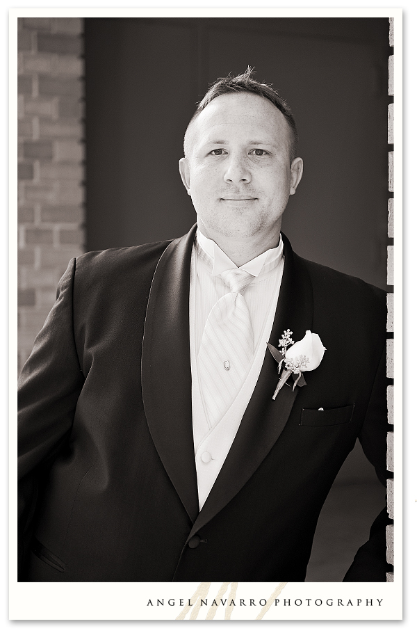 Outdoor photo of the groom in black and white.