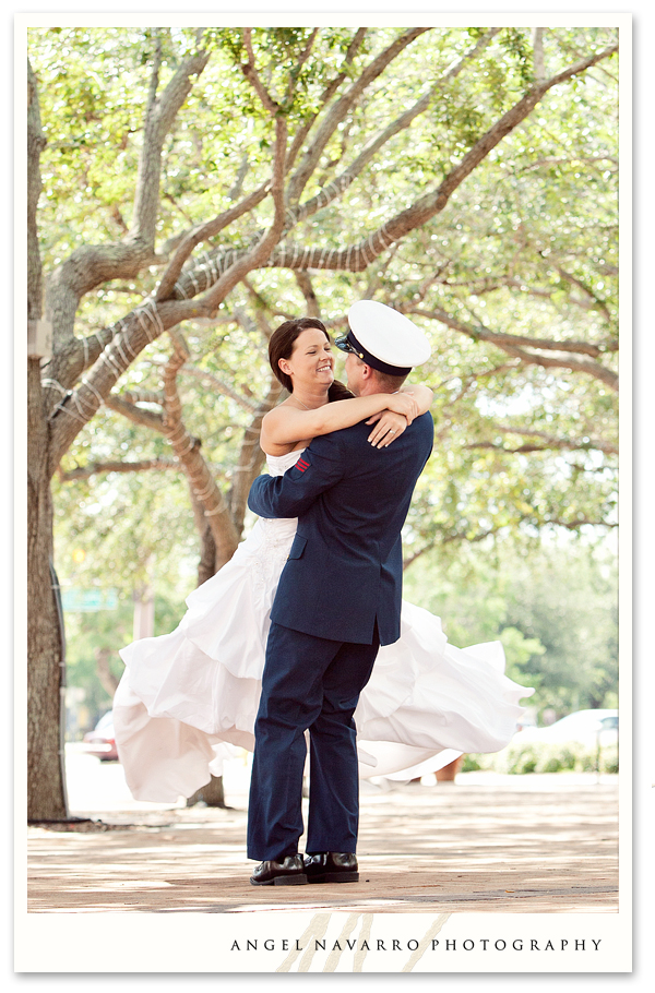 Military soldier spinning bride before wedding