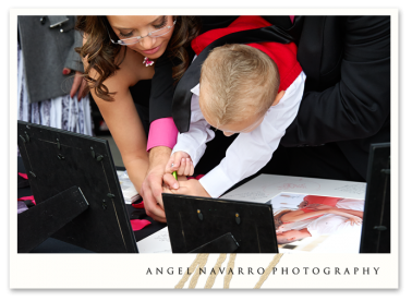 Ring bearer signs the engagement print.