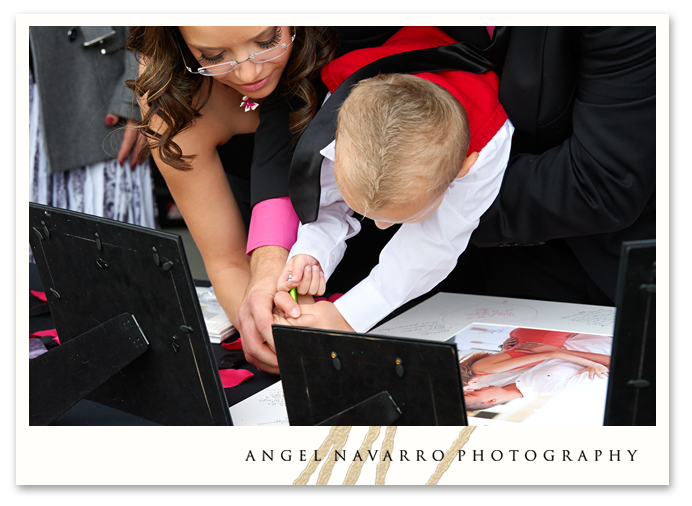 Ring bearer signs the engagement print.