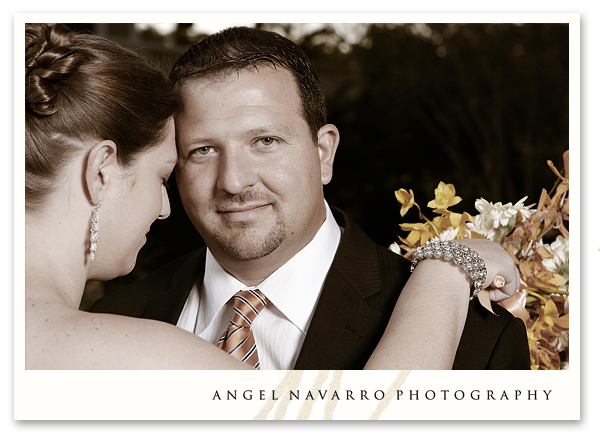 Photo of groom embraced by his bride