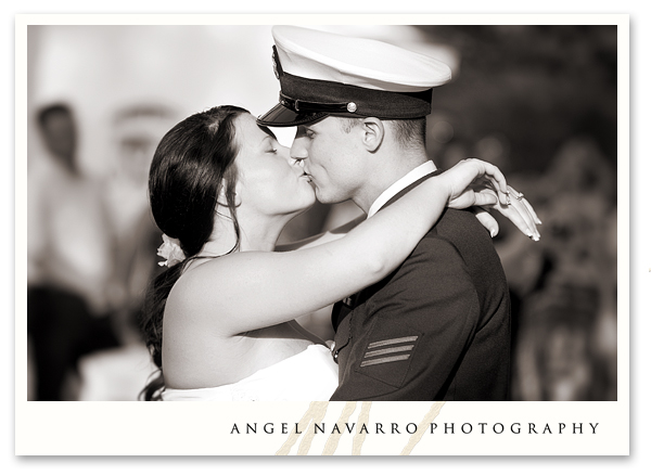 Soldier kissing bride reception dance