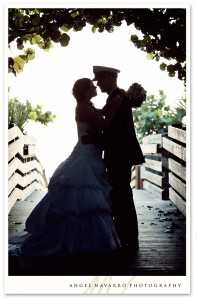 Soldier and bride outdoor kiss in silhouette
