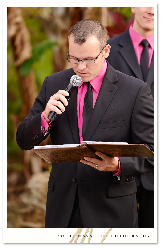 Groomsman reading during the wedding ceremony.
