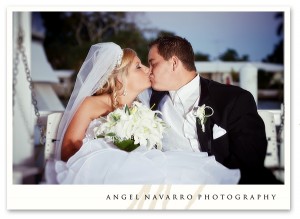 Bride and Groom Kissing on Bench