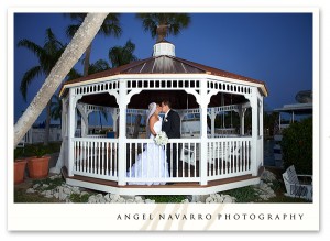 Bride and Groom Kissing in Gazebo at Night