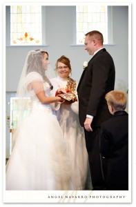 Officiant blesses the union of the bride and groom.