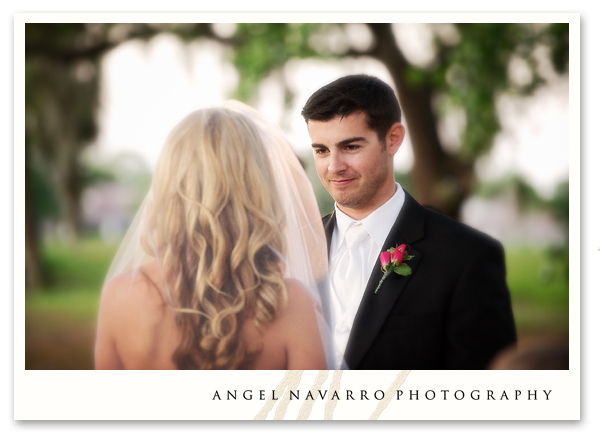 The bride and groom hold hands as they near the end of the ceremonial 